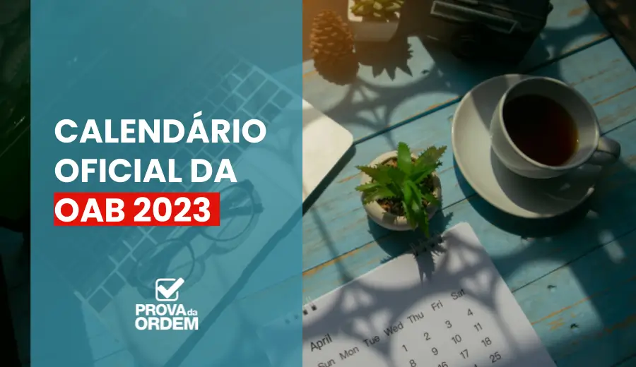 Café, notebook e um Calendário OAB 2023 sobre a mesa